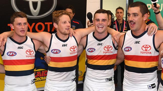 Matt Crouch, Rory Sloane, Brad Crouch and Taylor Walker sing the Crows song. Picture: Getty Images