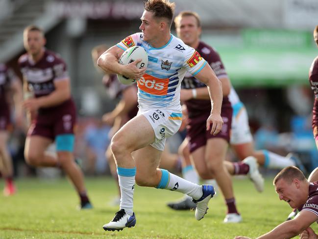 SYDNEY, AUSTRALIA - SEPTEMBER 19: Alexander Brimson of the Titans makes a break to score a try during the round 19 NRL match between the Manly Sea Eagles and the Gold Coast Titans at Lottoland on September 19, 2020 in Sydney, Australia. (Photo by Matt King/Getty Images)