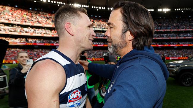 Joel Selwood embraced by coach Chris Scott after his last game.