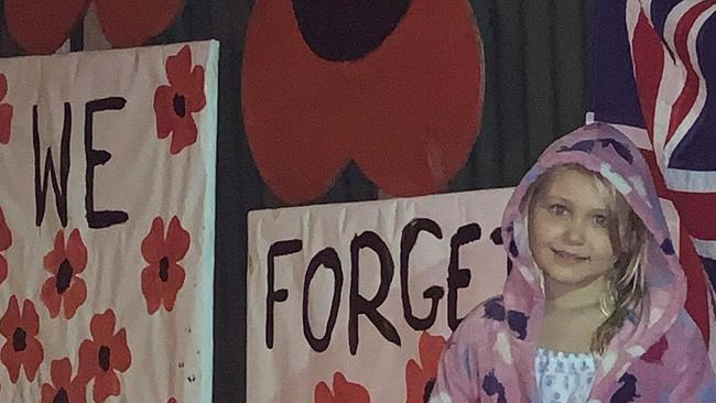 Pat Vanden-Brik’s granddaughter Arabella helped decorate the fence at Edens Landing.