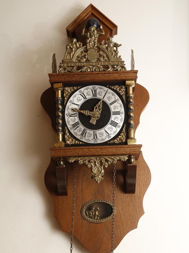 Two of the walls clocks in the abandoned house.