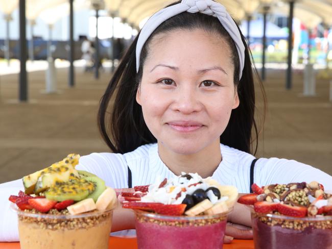 Chloe Uepa, from All Things Acai, poses with some of her products at the Entertainment Quarter.