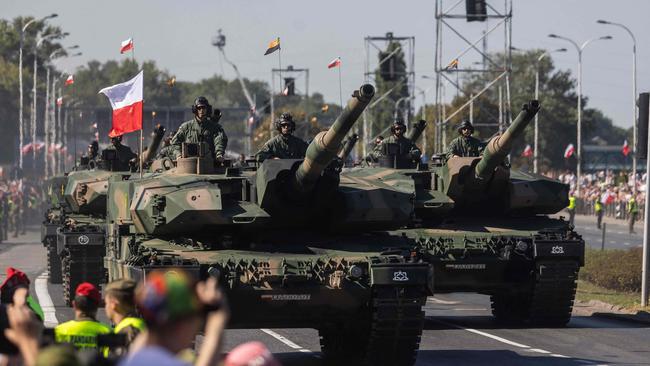 Tanks are driven through Warsaw on the anniversary of Poland’s 1920 victory over the Red Army. Picture: AFP