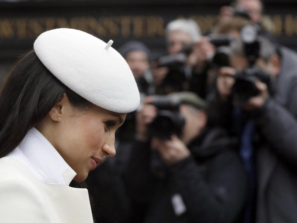 Photographers focus on US actor Meghan Markle as she leaves a service at Westminster Abbey in 2018. Picture: AFP.