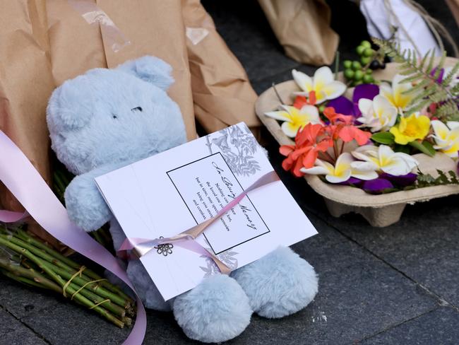 A teddy bear is left at the tribute area at Bondi Junction. Picture: Damian Shaw