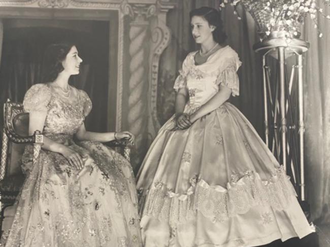 The sisters are in ball gowns during a pantomime performance during the Second World War. Picture: Getty Images