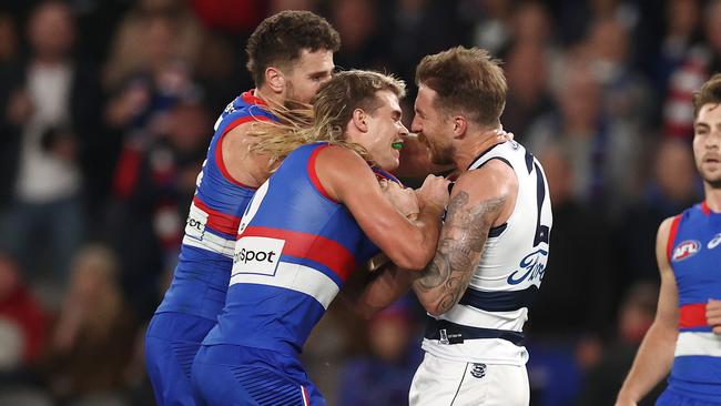 Bailey Smith and Zach Tuohy of the Cats tussle. Photo by Michael Klein