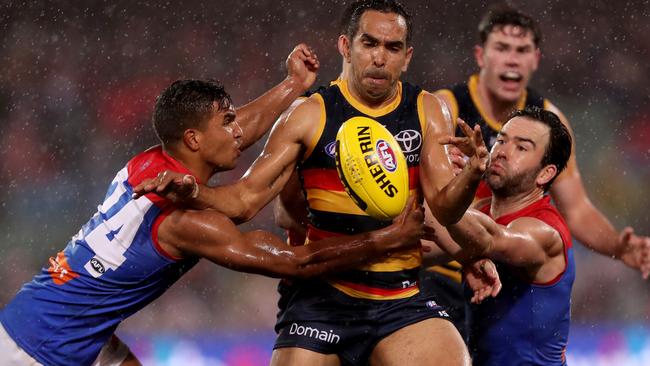 Adelaide’s Eddie Betts is tackled by Demons Jay Kennedy Harris and Jordan Lewis at Adelaide Oval. Oicture: James Elsby/Getty