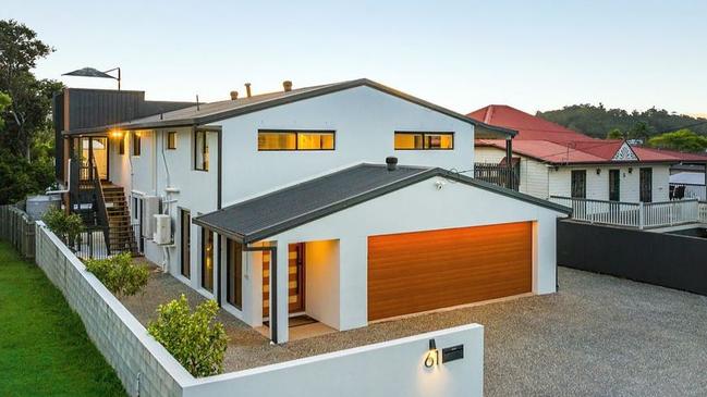 This home at 61 Bonneville St, Holland Park West, is going to auction this Friday.