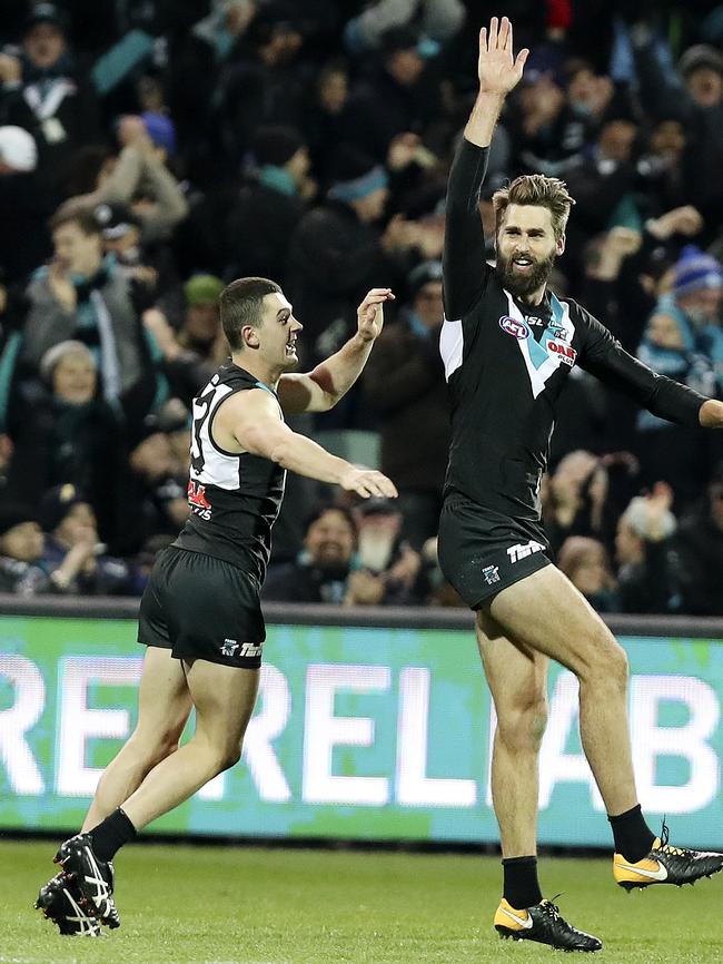 Darcy Byrne-Jones celebrates a goal with Justin Westhoff against Melbourne. He has been stood down for being late for training. Picture Sarah Reed