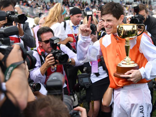 Williams with last year’s Melbourne Cup trophy at a packed headquarters.