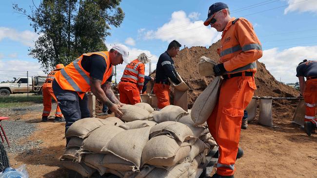 SES volunteers are frantically filling thousands of sandbags in Forbes. Picture: Gary Ramage