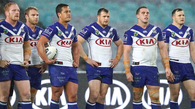 Bulldogs players look dejected after an Eels try at ANZ Stadium.