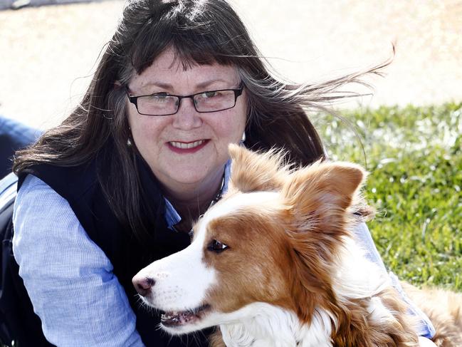 Dog behaviourist Merry Conway talks about how to make your dog less anxious - picture of Merry with happy dog (beige border collie, Sweep from Kingston at the Kingston beach dog reserve.picture;KIM EISZELE