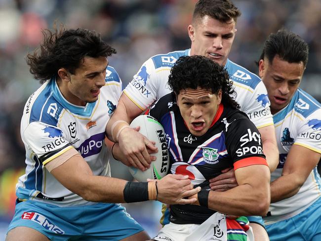 AUCKLAND, NEW ZEALAND - SEPTEMBER 03:  Dallin Watene-Zelezniak of the Warriors is tackled by Tino Fa`asuamaleaui (L), Beau Fermor and Phillip Sami of the Titans during the round 25 NRL match between the New Zealand Warriors and the Gold Coast Titans at Mt Smart Stadium, on September 03, 2022, in Auckland, New Zealand. (Photo by Dave Rowland/Getty Images)