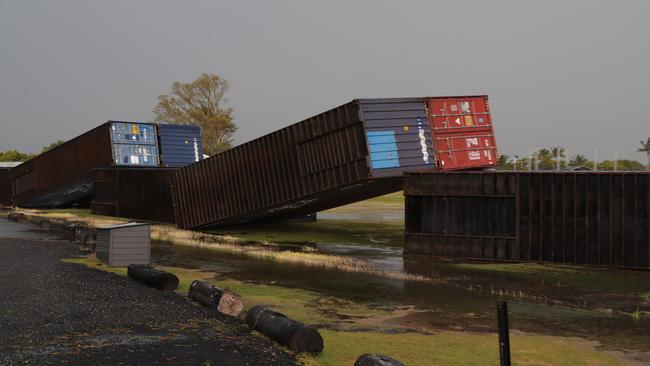 Fallen shipping containers at Sandstone Point as wild storms lashed Bribie Island. Picture: Lachie Millard