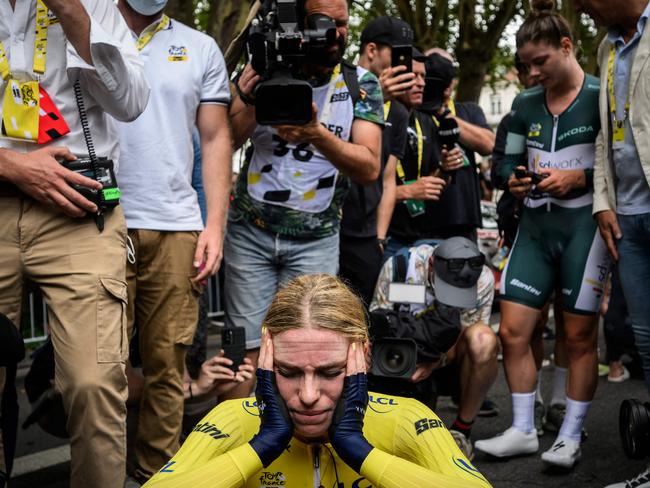 Dutch rider Demi Vollering takes a moment, wearing the overall leader's yellow jersey in the Womens Tour de France. Picture: Jeff Pachoud/AFP