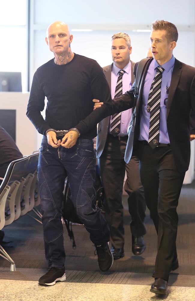 Nick the Knife Forbes being extradited from South Australia.