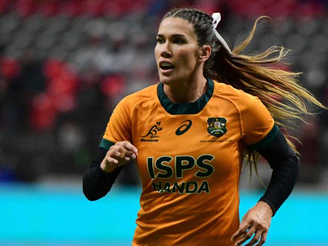 Australiaâs Charlotte Caslick in action during the 2024 HSBC Canada Sevens rugby tournament match between Australia and Fiji at BC Place Stadium in Vancouver, Canada, on February 23, 2024. (Photo by Don MacKinnon / AFP)