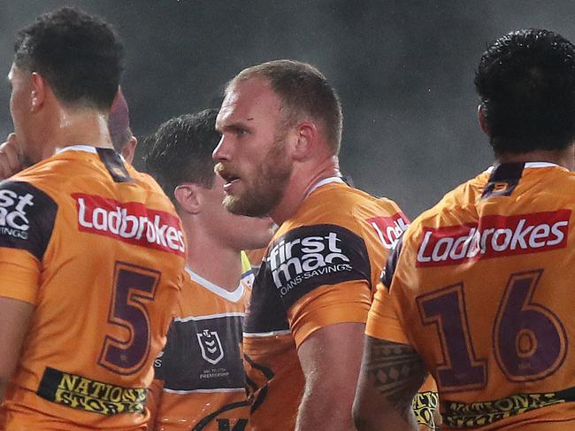 Dejected Brisbane players after a try by Souths Adam Reynolds during the Souths v Broncos NRL match at ANZ Stadium, Homebush. Picture: Brett Costello