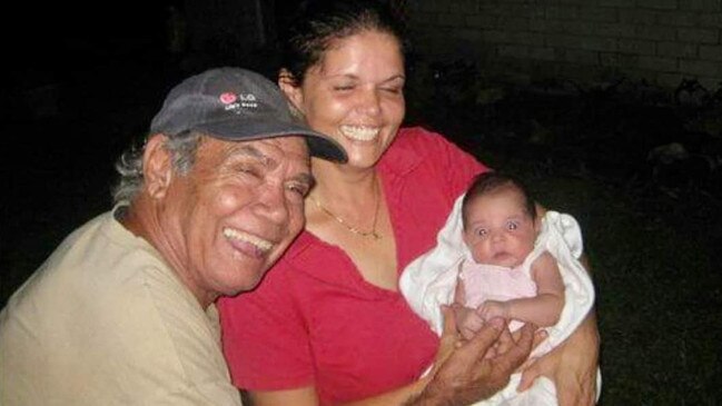 Darwin AFL player Jimmy Anderson with Amelia Anderson and another baby in happier times.