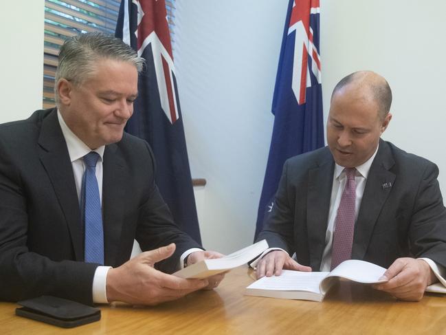 CANBERRA, AUSTRALIA - OCTOBER 06: Treasurer Josh Frydenberg (R) and Finance Minister Mathias Cormann pose for photos during a photographic opportunity on Budget Day in the Treasurer's office at Parliament House on October 6, 2020 in Canberra, Australia. (Photo by Mike Bowers - Pool/Getty Images)