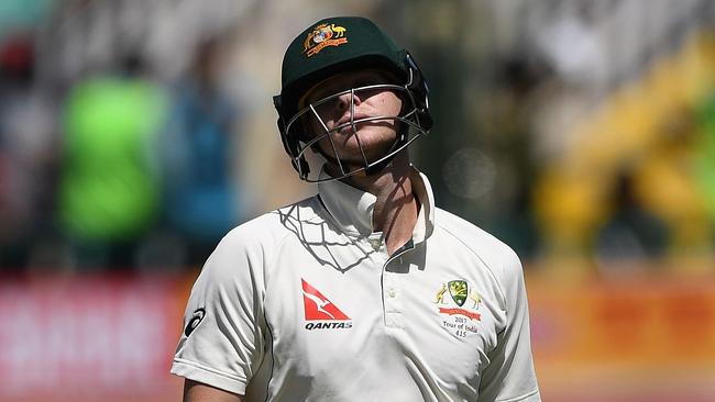 Australia's captain Steve Smith reacts as he walks back to the pavilion after his dismissal by India's Bhuvneshwar Kumar during the third day of the fourth and last Test cricket match between India and Australia at The Himachal Pradesh Cricket Association Stadium in Dharamsala on March 27, 2017. ----IMAGE RESTRICTED TO EDITORIAL USE - STRICTLY NO COMMERCIAL USE----- / GETTYOUT---- / AFP PHOTO / PRAKASH SINGH / ----IMAGE RESTRICTED TO EDITORIAL USE - STRICTLY NO COMMERCIAL USE----- / GETTYOUT