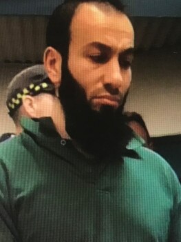Bassam Hamzy looked older and heavier as he shuffled into the dock.