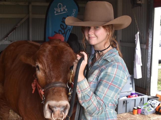 Alex Olive with Apis Creek's Brangus bull Davey Gravy. Davey Gravy is a led steer Brangus. Picture: Matthew Forrest