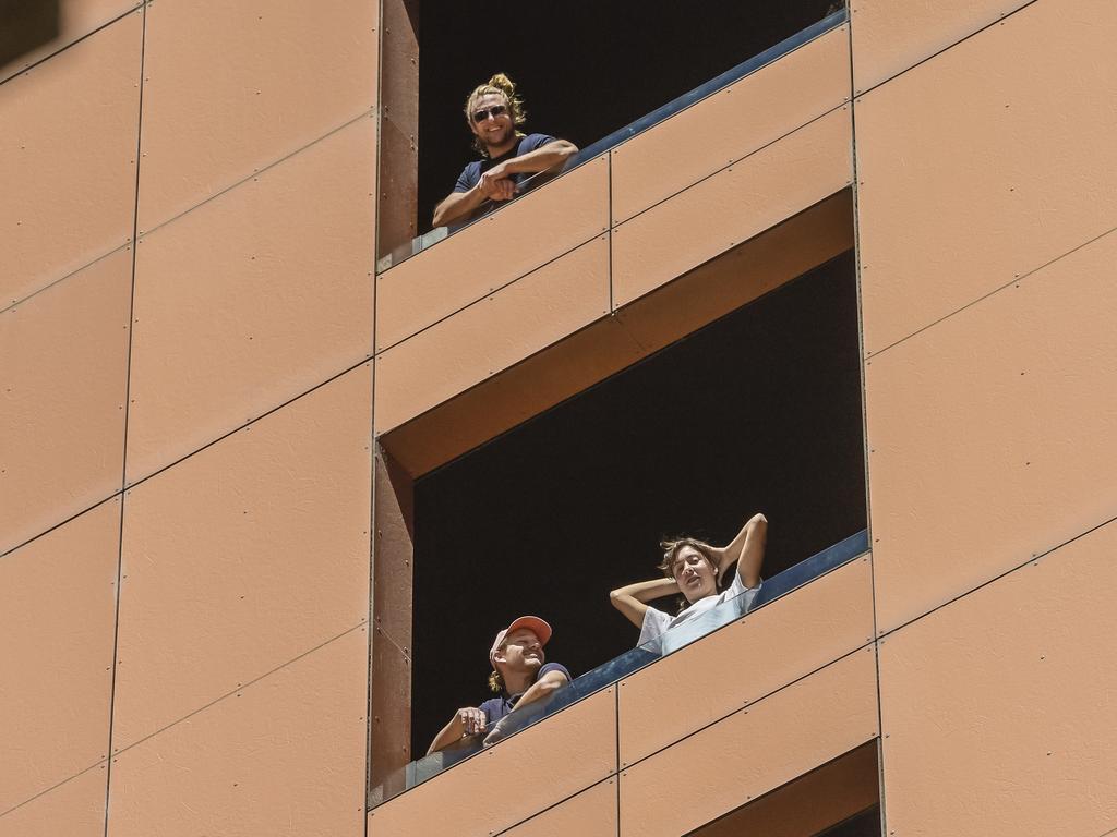 More returned travellers are pictured on the balconies at the medi-hotel. Picture: Roy VanDerVegt/NCA NewsWire