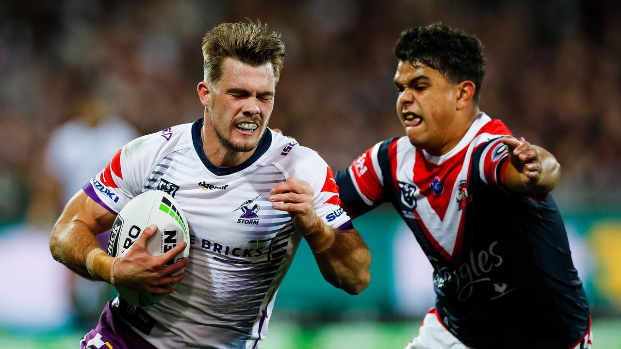 Ryan Papenhuyzen of the Storm is tackled by Latrell Mitchell