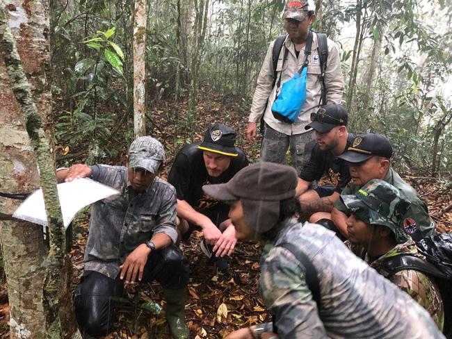 Richmond players Nick Vlastuin and Jack Graham trekking through the jungle in Sumatra with the World Wildlife Fund Tiger Protection Unit. Picture: Richmond Football Club