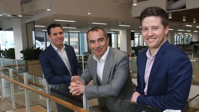 GMHBA CEO David Greig, left, chief financial officer Wes Self, right, with Shane Quinn, executive chairman of Quintessential Equity. Picture: Alan Barber