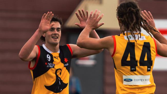 Ned Moodie (right) celebrates of the Dandenong Stingrays celebrates one of his five goals. Pic: Jasmine Bennett