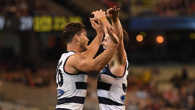 Tom Hawkins (left) and Patrick Dangerfield of the Cats react after Hawkins kicked a goal during the second semi-final between the Geelong Cats and the Sydney Swans at MCG in Melbourne, Friday, September 15, 2017. (AAP Image/Julian Smith) NO ARCHIVING, EDITORIAL USE ONLY