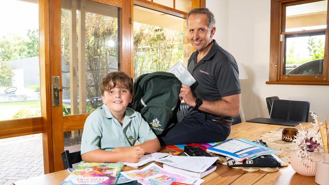 Westminster student Levi, 8, with father and old scholar Richard Bund at their home in Hawthorn. Picture: Morgan Sette