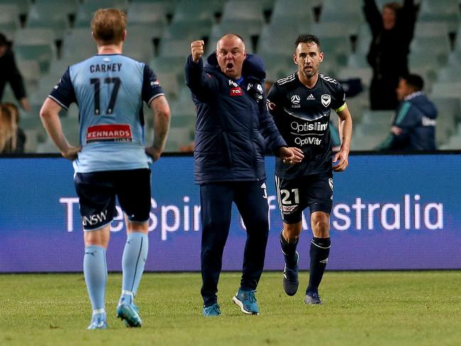 A Melbourne Victory coach member gestures towards David Carney after Melbourne scored the match winner in extra time during the semi-final match between Sydney FC and Melbourne Victory at Allianz Stadium, Sydney. Picture: Toby Zerna