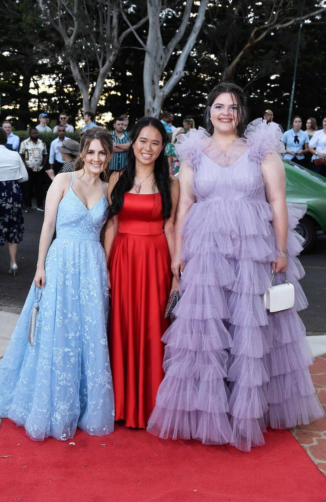 Eliza Kelly, Lucy Cook and Tracey Bradford at Centenary Heights State High School formal. Picture; Patrick Woods.