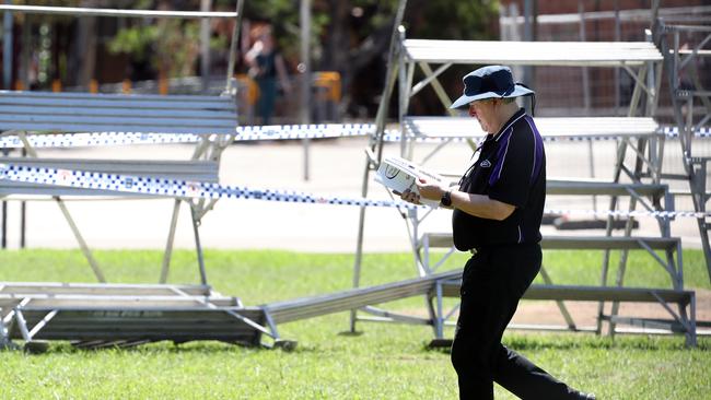 School photo photographer at the scene of a scaffolding collapse at Campbelltown high school. Picture: Jonathan Ng