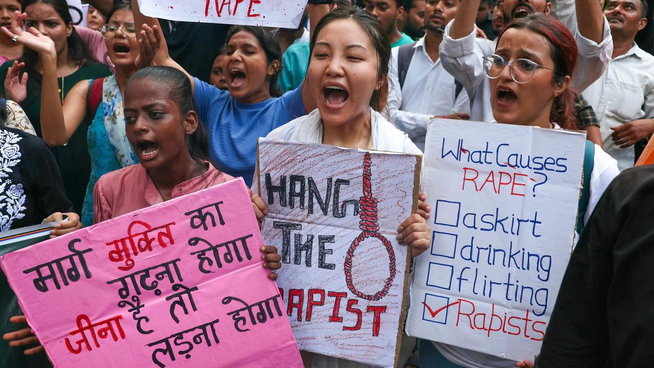 Banaras Hindu University students hold posters and shout slogans during a march against the attack. Picture: Niharika Kulkarni/AFP