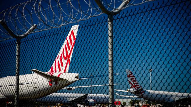 Virgin Australia aircraft parked on the tarmac at Brisbane International Airport. Picture: Patrick Hamilton/AFP