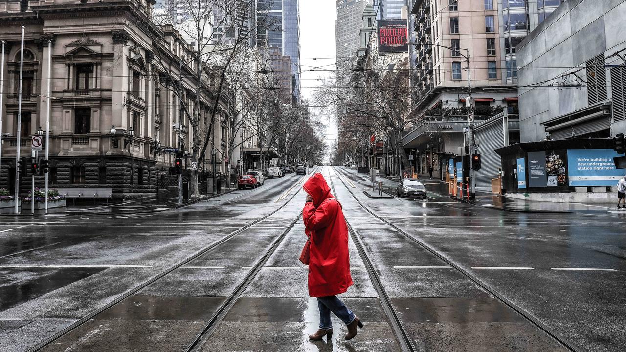 A woman crosses Collins St in Melbourne's CBD during the fifth lockdown. Picture: NCA NewsWire / Ian Currie