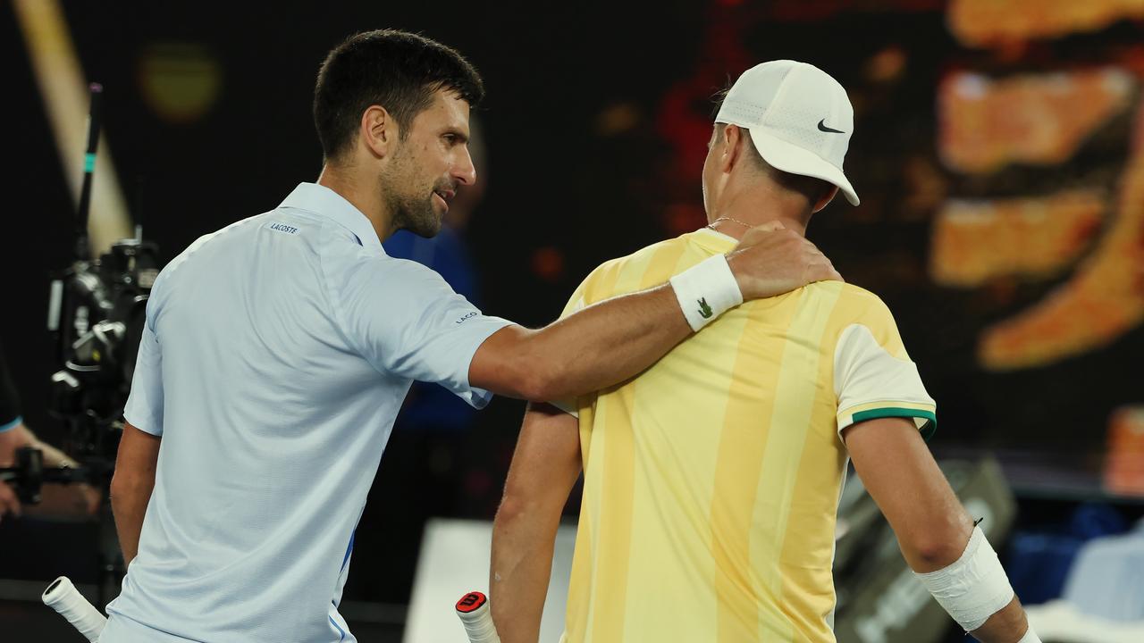 MELBOURNE , AUSTRALIA. January 14, 2024. Australian Open Tennis. Day 1. Novak Djokovic vs Dino Prizmic on Rod Laver Arena. Novak Djokovic congratulates his opponent Dino Prizmic after three 4 set 4 hour match . Pic: Michael Klein