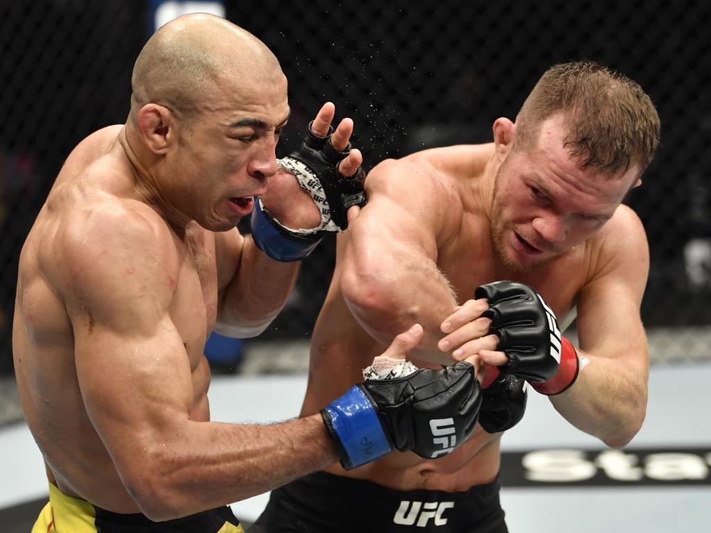 Petr Yan elbows Jose Aldo. (Photo by Jeff Bottari/Zuffa LLC)