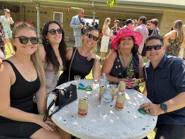 A group having a ball at Torbanlea Picnic Races.