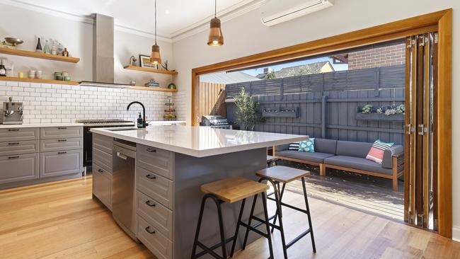 The home included an elegant kitchen which opened to a deck with a built-in barbecue.