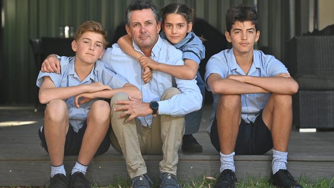 Sacred Heart teacher Dave Higgins - pictured with children Darcy, Jess and Aussie - has been affected by Covid isolation rules, with his daughter and wife both getting Covid and the whole family forced to isolate for 14 days. Picture: Keryn Stevens