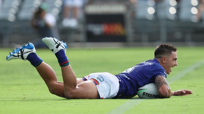 Kodi Nikorima of the Warriors scores a try during the round-one NRL match between the New Zealand side and the Gold Coast Titans at Central Coast Stadium on Saturday. Picture: Ashley Feder/Getty Images