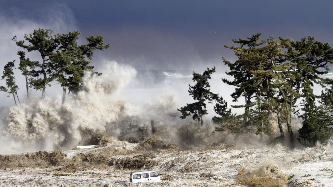 This picture taken on March 11, 2011 by Sadatsugu Tomizawa and released via Jiji Press on March 21, 2011 shows tsunami waves hitting the coast of Minamisoma in Fukushima prefecture. The number of people confirmed dead or listed as missing in Japan neared 22,000, 10 days after a massive earthquake and tsunami struck the country's northeast coast.  AFP PHOTO / JIJI PRESS / AFP PHOTO / JIJI PRESS / SADATSUGU TOMIZAWA