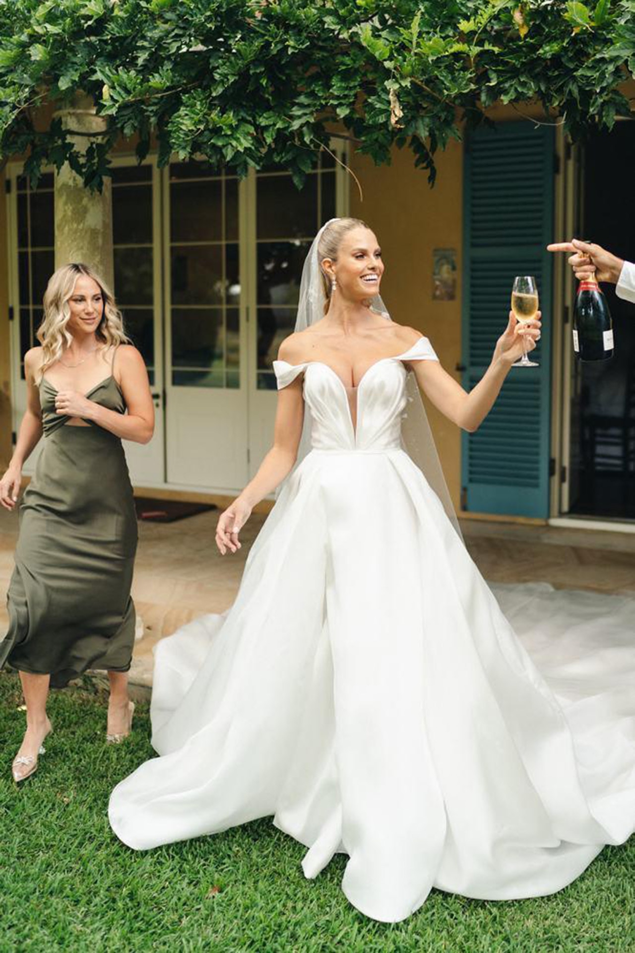 <p><em>Image Credits: Wedding photographer: Jack Henry. From <a href="https://www.vogue.com.au/brides/weddings/natalie-roser-harley-bonner-wedding/image-gallery/f7a65e5dd3db8d56711d03114bac37ea" target="_blank" rel="noopener">inside a model and &lsquo;Home and Away&rsquo; actor&rsquo;s luminous, saffron-coloured Hunter Valley wedding</a></em></p><h2>Natalie Roser in Leah da Gloria</h2><p>Australian model Natalie Roser and Harley Bonner wedded in classic elegant flair, with an illustrious ivy-leaved backdrop set in the Hunter Valley in February 2022. Roser wore a plunging, off-the-shoulder bridal gown designed by Leah da Gloria, whom she previously modelled for. She paired the gown with mesh Dior bridal shoes and a sleek back ponytail. The veil was a statement in its simplicity&mdash;the thin tulle appliqued with intricate lace beading and embroidery.</p>